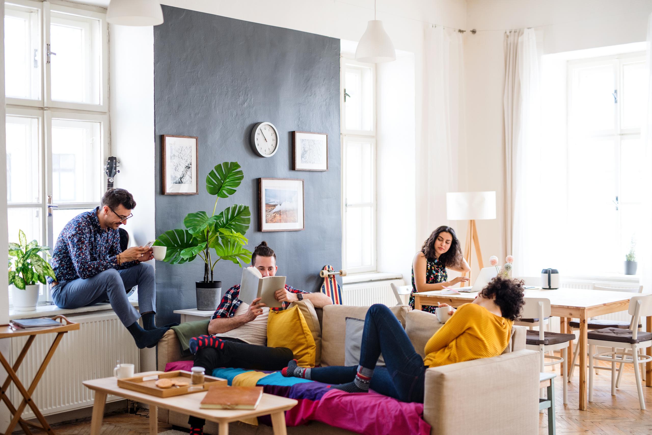 young adults relaxing and reading