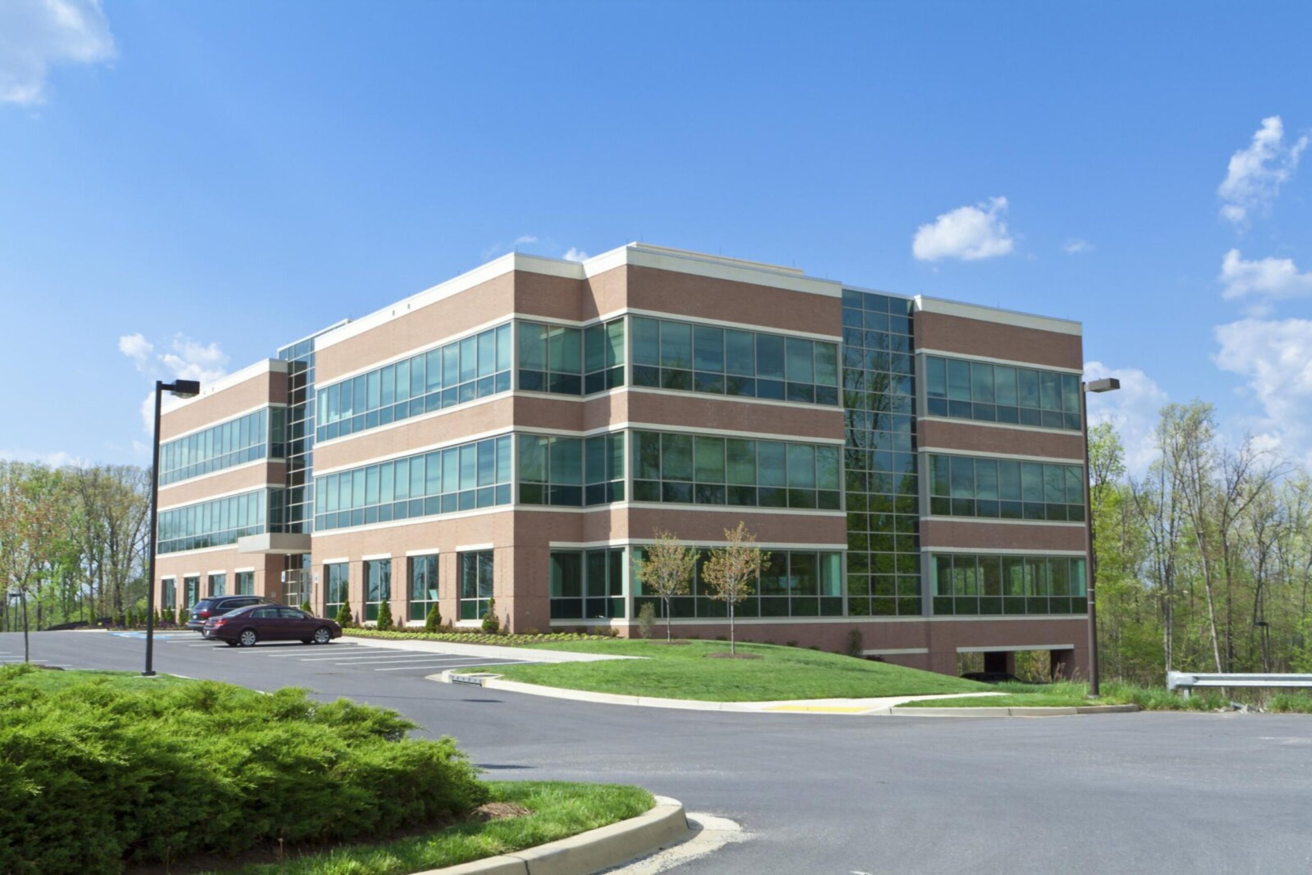 Modern Commercial Office Building with Landscaped Surroundings exterior image of commercial building