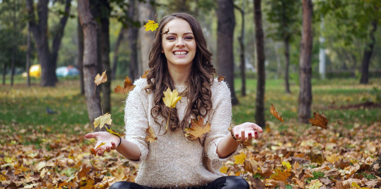 Female with fallen leaves
