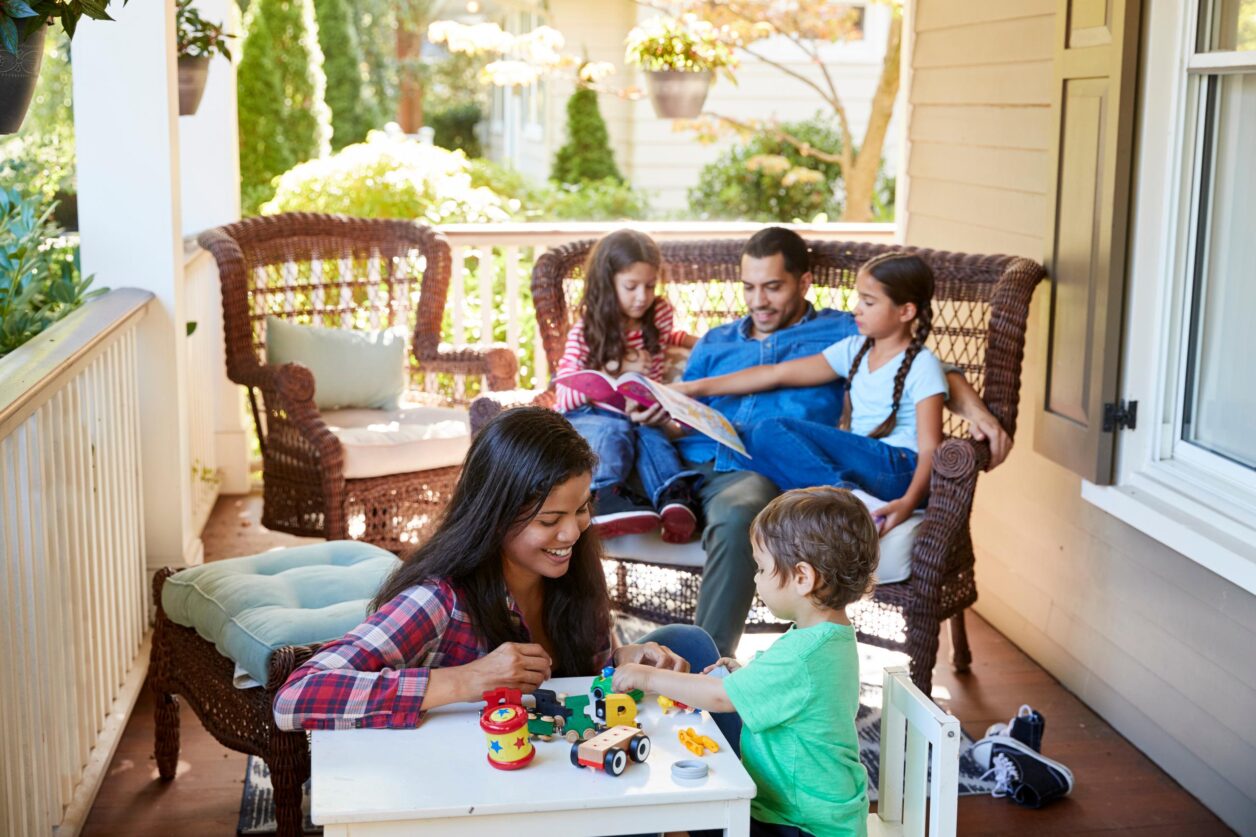 family enjoying time together on porch
