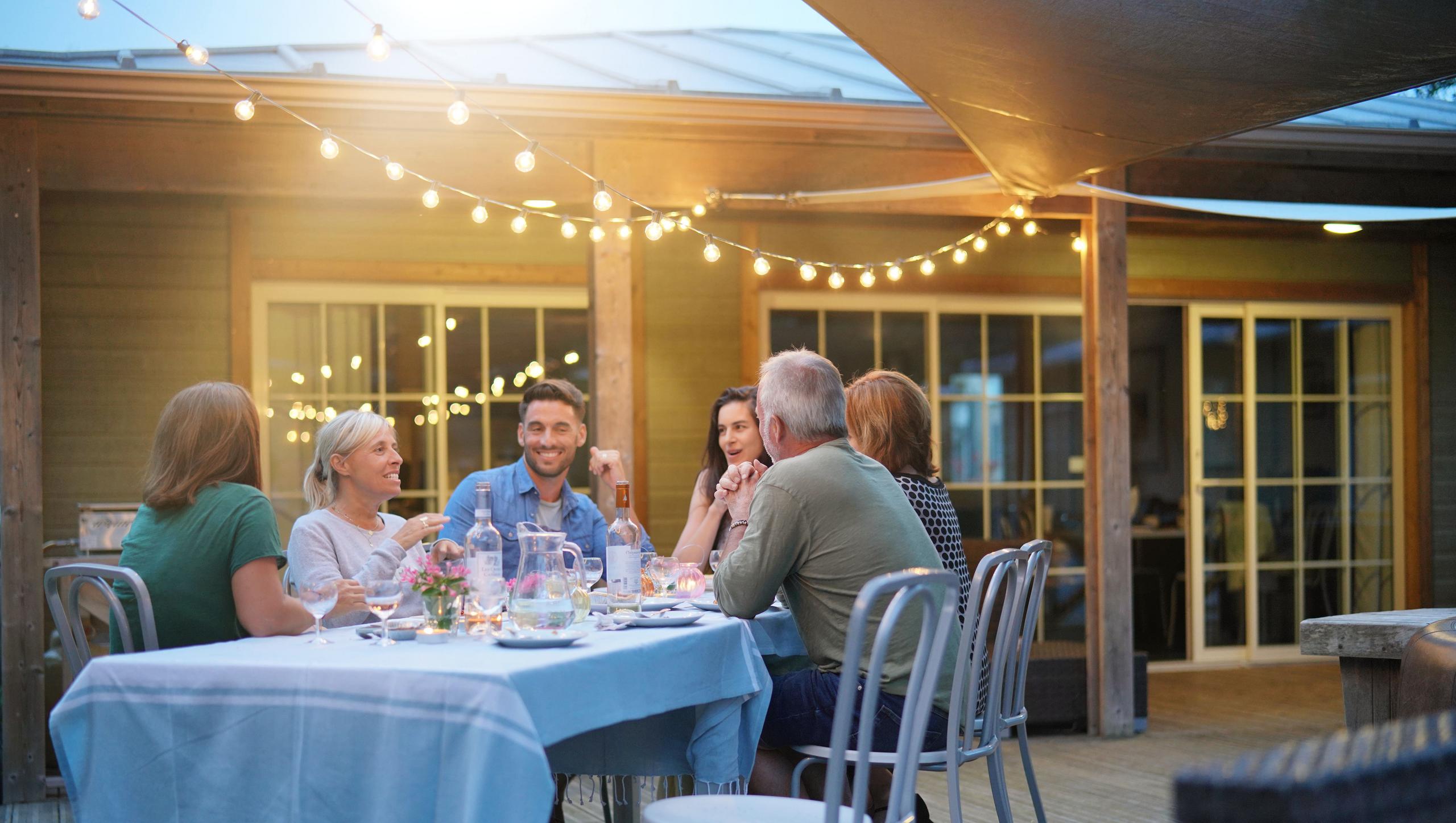 family dining on deck